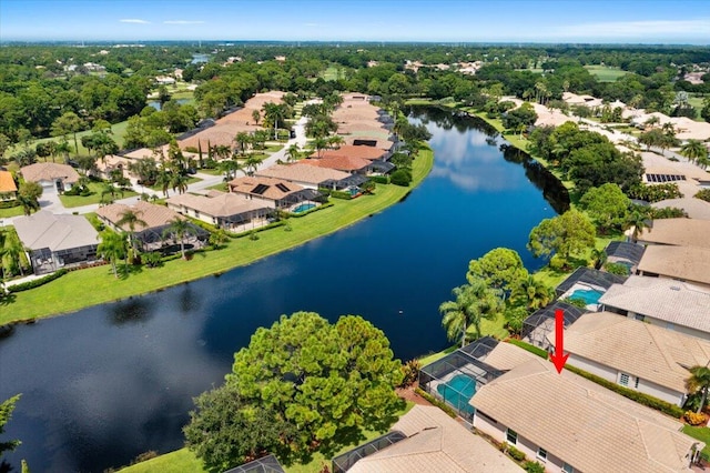 birds eye view of property with a water view