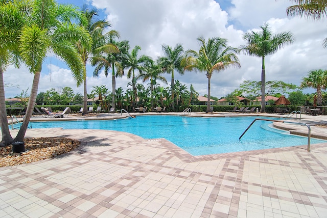 view of swimming pool with a patio area