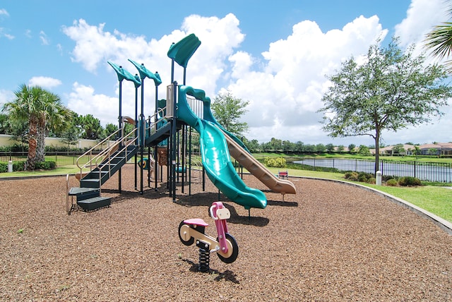 view of playground with a water view