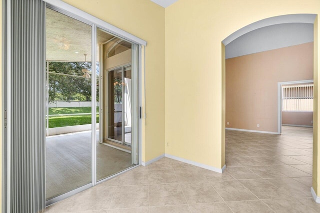 empty room featuring light tile patterned floors