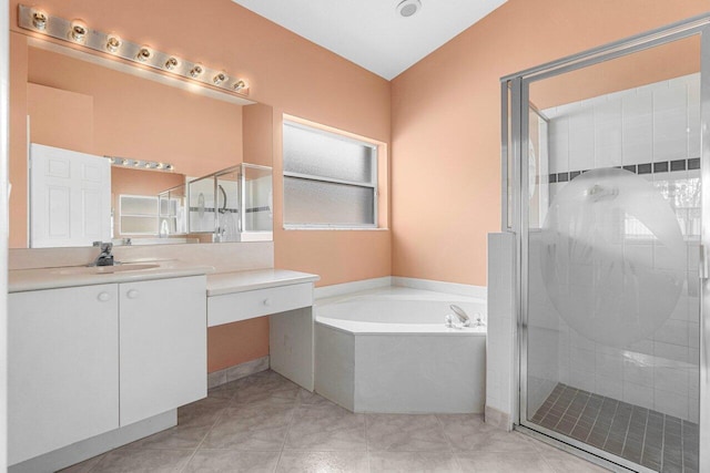 bathroom featuring shower with separate bathtub, tile patterned floors, and vanity