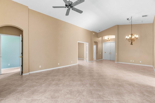 spare room with ceiling fan with notable chandelier, light tile patterned floors, and high vaulted ceiling