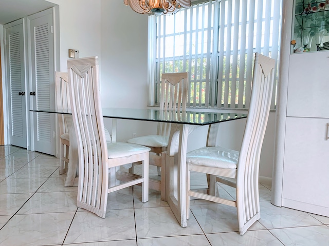 dining space with an inviting chandelier