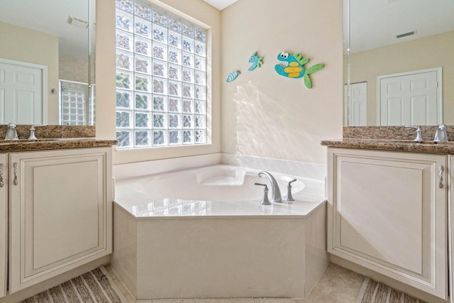 bathroom with vanity, plus walk in shower, and tile patterned floors