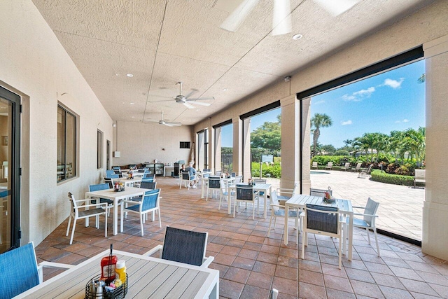 view of patio / terrace featuring ceiling fan