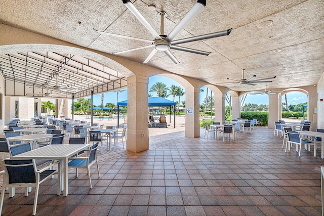 view of patio / terrace with ceiling fan and a gazebo