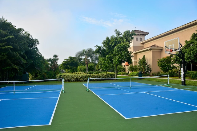 view of tennis court featuring basketball court