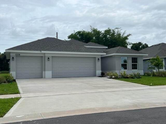 ranch-style home featuring a garage