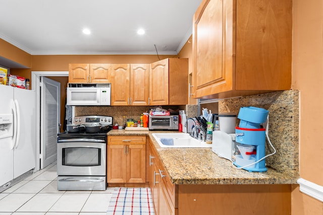 kitchen featuring ornamental molding, sink, light tile patterned flooring, and white appliances