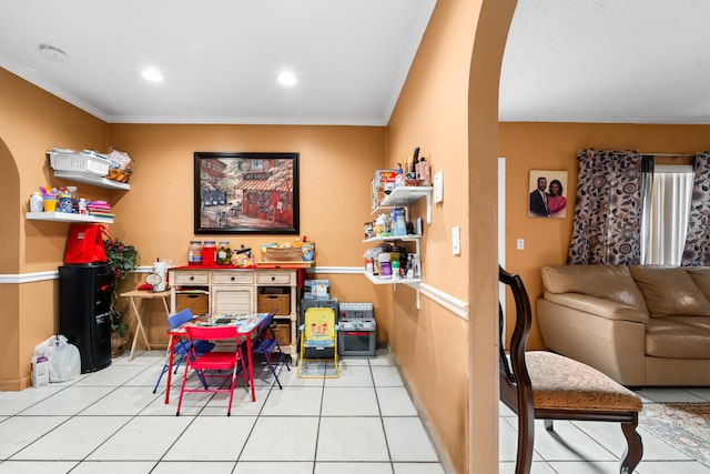 playroom with crown molding and light tile patterned floors