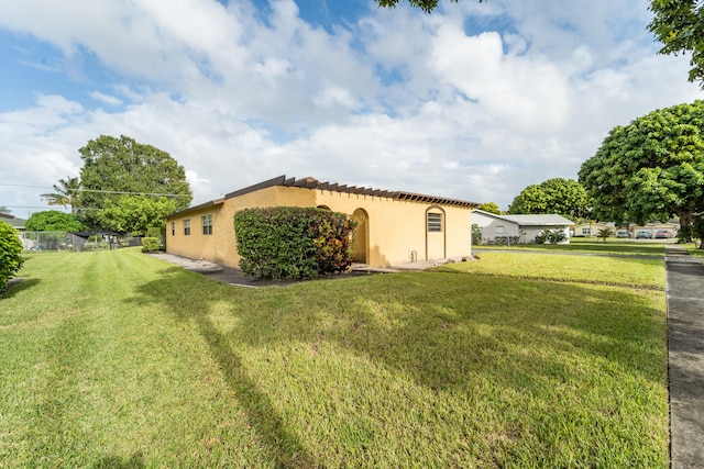 view of property exterior featuring a yard