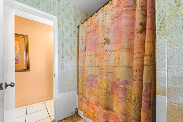 bathroom with tile patterned floors and curtained shower