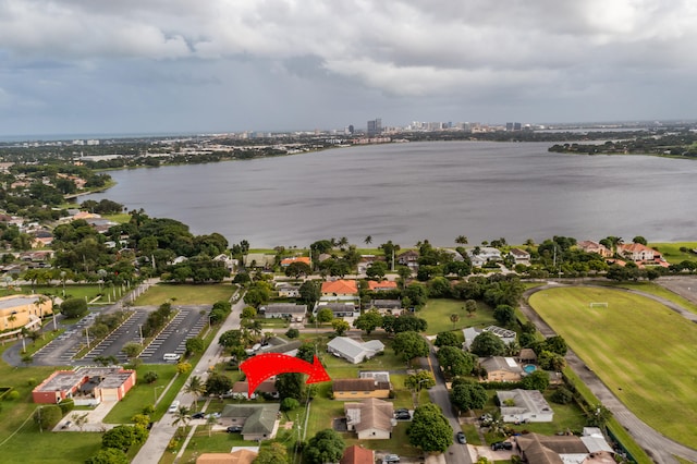 birds eye view of property with a water view