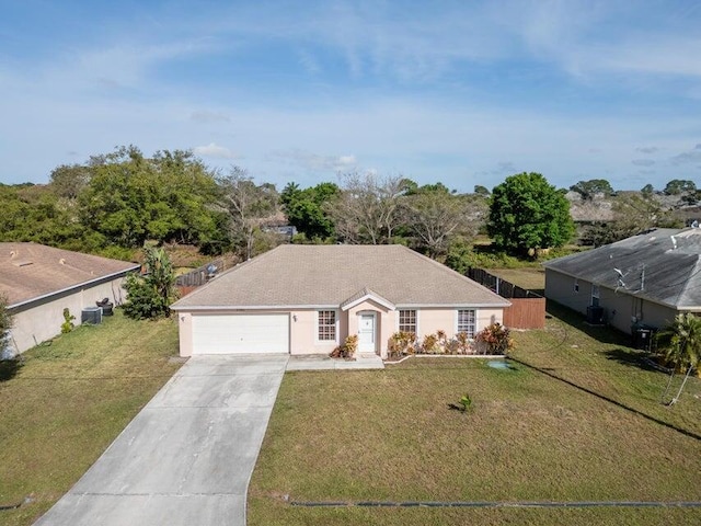 ranch-style house featuring a garage and a front lawn