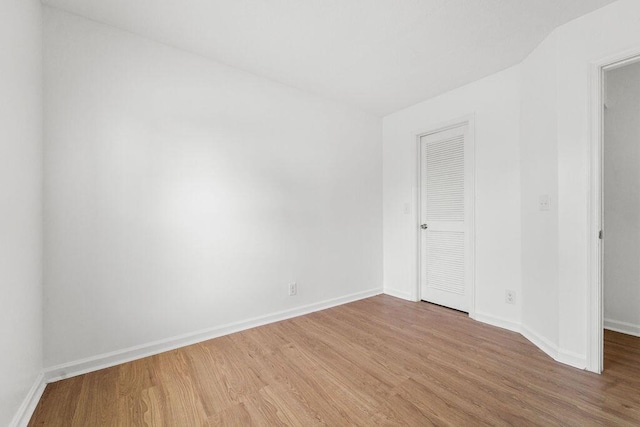 empty room featuring hardwood / wood-style flooring