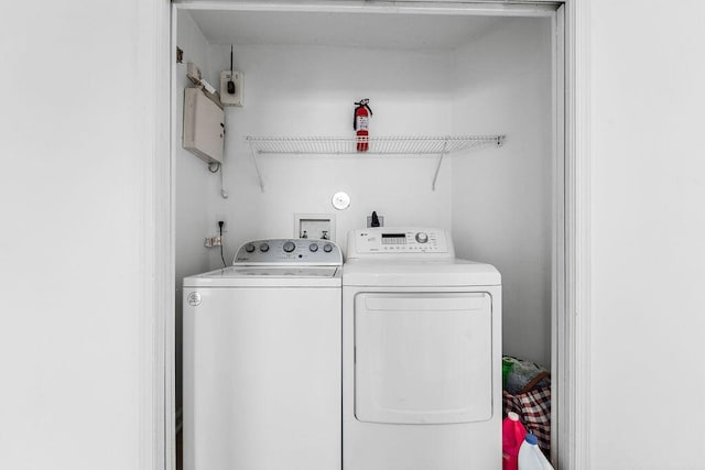 laundry area with separate washer and dryer