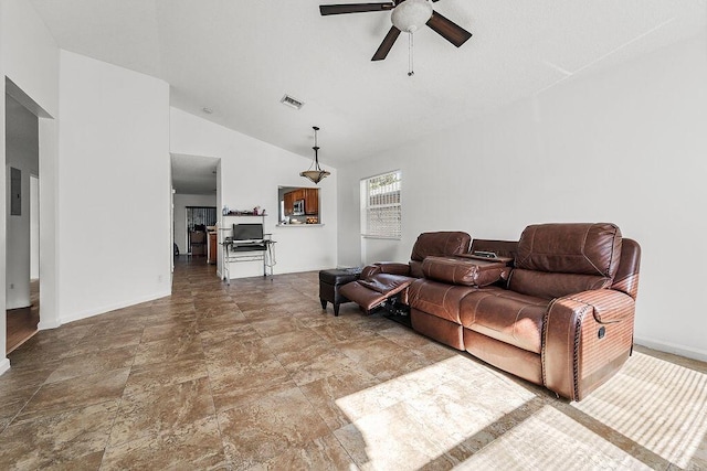 living room featuring ceiling fan and vaulted ceiling