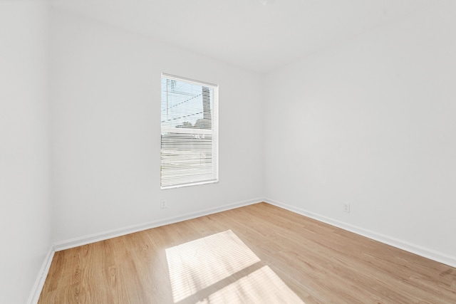 spare room with light hardwood / wood-style floors