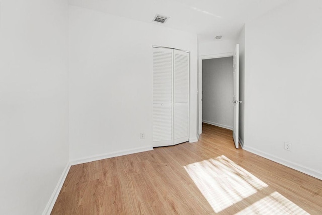 unfurnished room with light hardwood / wood-style floors