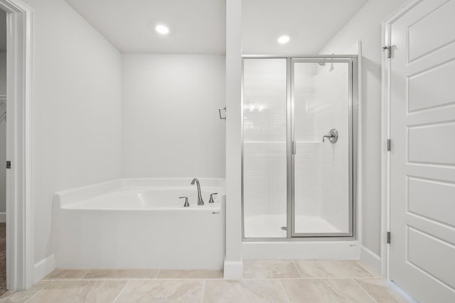 bathroom featuring separate shower and tub and tile patterned floors