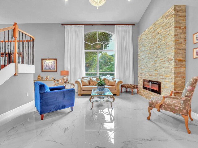 living room with a stone fireplace