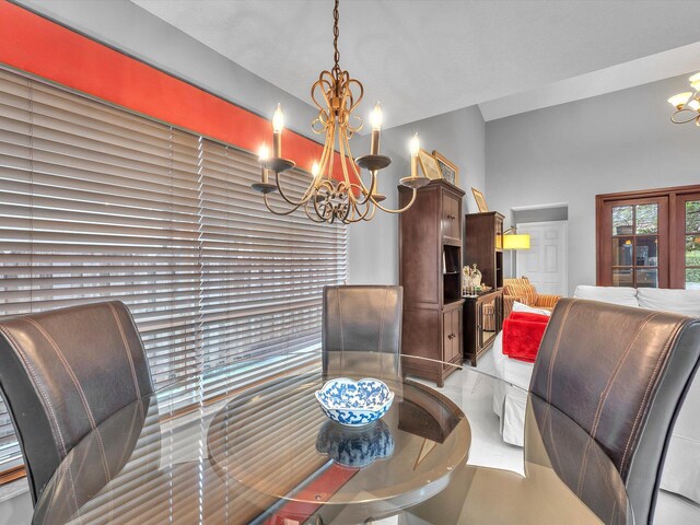 dining space featuring a notable chandelier