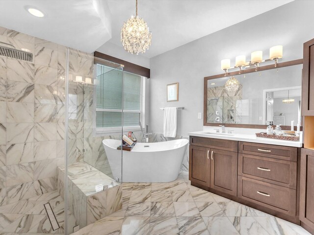 bathroom with plus walk in shower, vanity, and an inviting chandelier