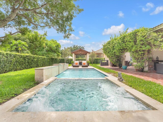 view of swimming pool featuring a patio, an in ground hot tub, a gazebo, and pool water feature