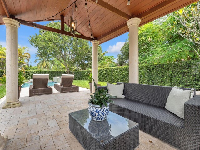 view of patio / terrace featuring an outdoor hangout area and a gazebo