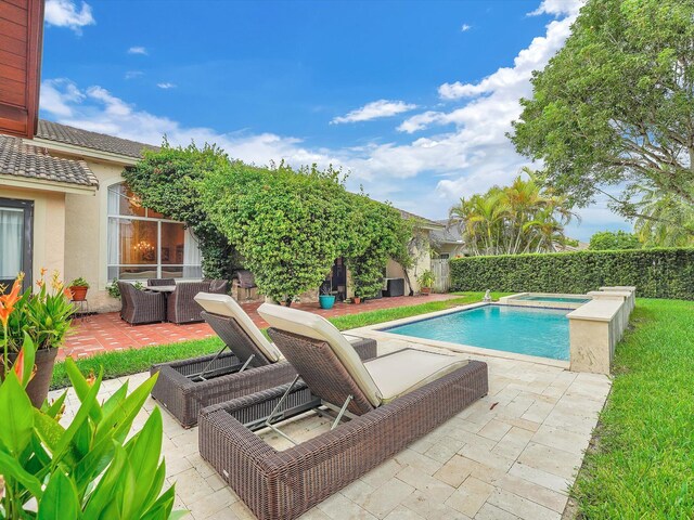 view of pool featuring a patio