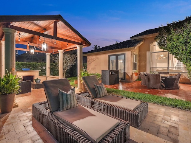 patio terrace at dusk with an outdoor hangout area