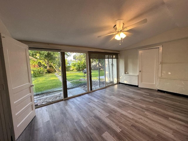 unfurnished room featuring wood-type flooring, lofted ceiling, and ceiling fan