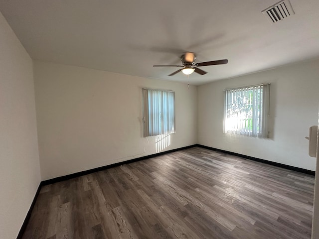 unfurnished room with ceiling fan and hardwood / wood-style flooring