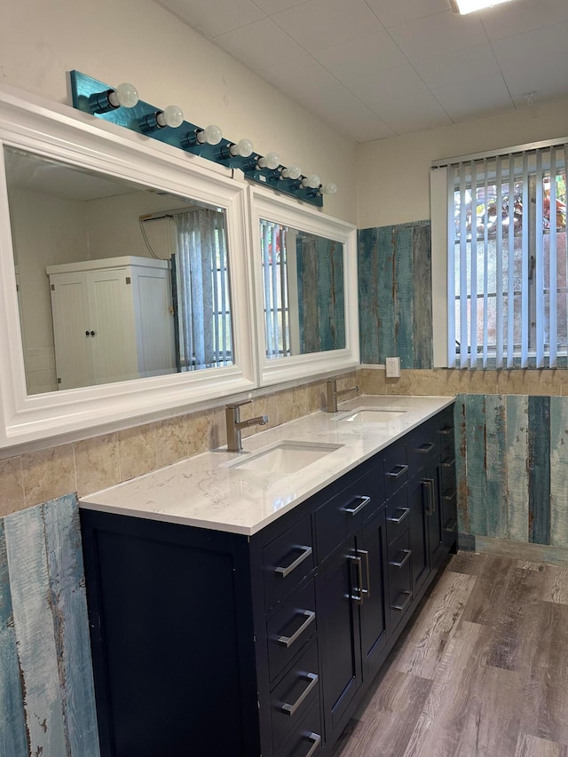 bathroom with vanity and hardwood / wood-style flooring