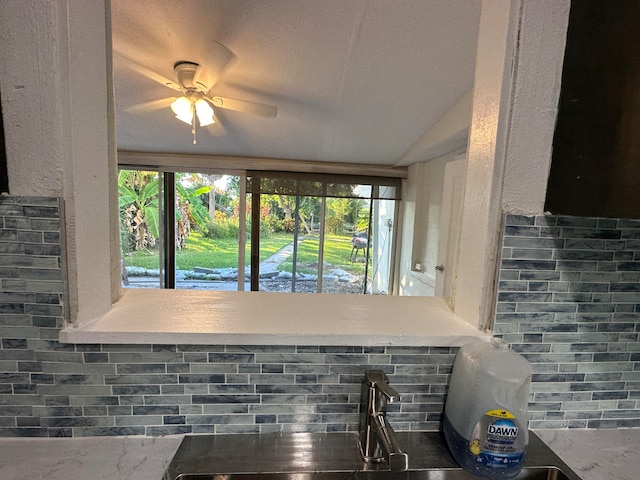 interior space featuring backsplash and ceiling fan