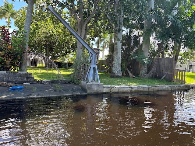 exterior space featuring a water view and a yard