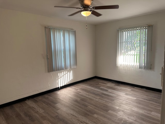 spare room featuring light wood-type flooring and ceiling fan