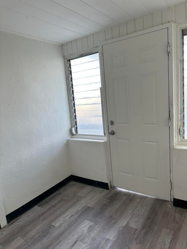 entryway featuring wood ceiling and hardwood / wood-style flooring