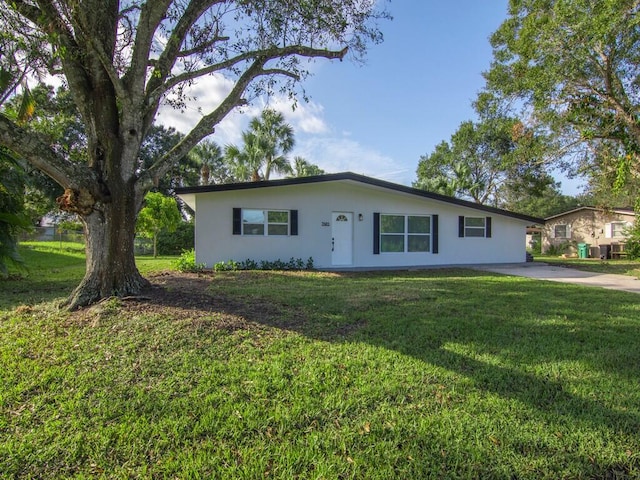 ranch-style house with a front yard