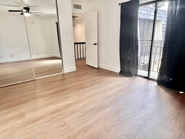 spare room featuring ceiling fan and light hardwood / wood-style floors