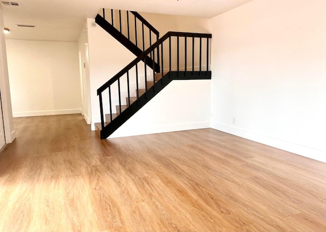 stairway with wood-type flooring