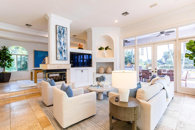 15495 Tall Oak Ave, Delray Beach, FL 33446 - living area with visible vents, crown molding, ceiling fan, and built in shelves