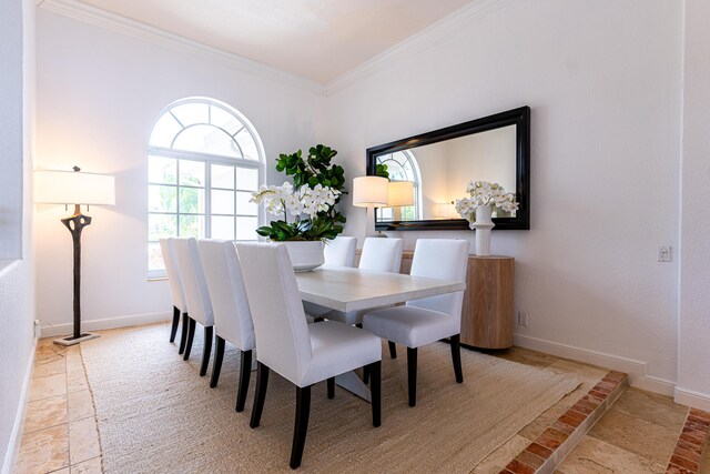 15495 Tall Oak Ave, Delray Beach, FL 33446 - dining room with ornamental molding, stone tile floors, and baseboards