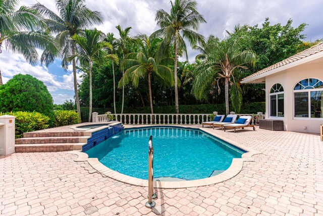 15495 Tall Oak Ave, Delray Beach, FL 33446 - view of swimming pool with a patio and a pool with connected hot tub
