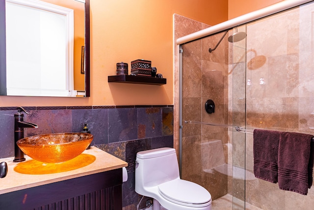 15495 Tall Oak Ave, Delray Beach, FL 33446 - full bath with tile walls, a shower stall, toilet, vanity, and wainscoting