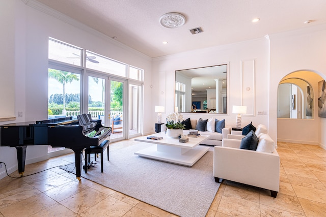 living room with a textured ceiling and crown molding