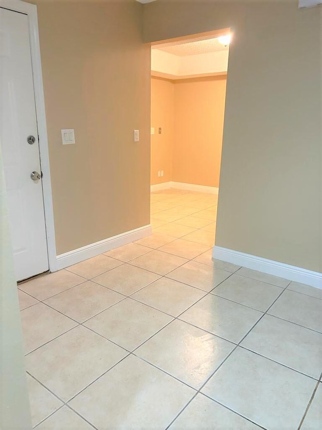 spare room with light tile patterned floors