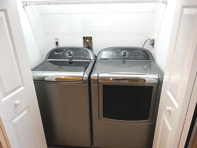 washroom with separate washer and dryer