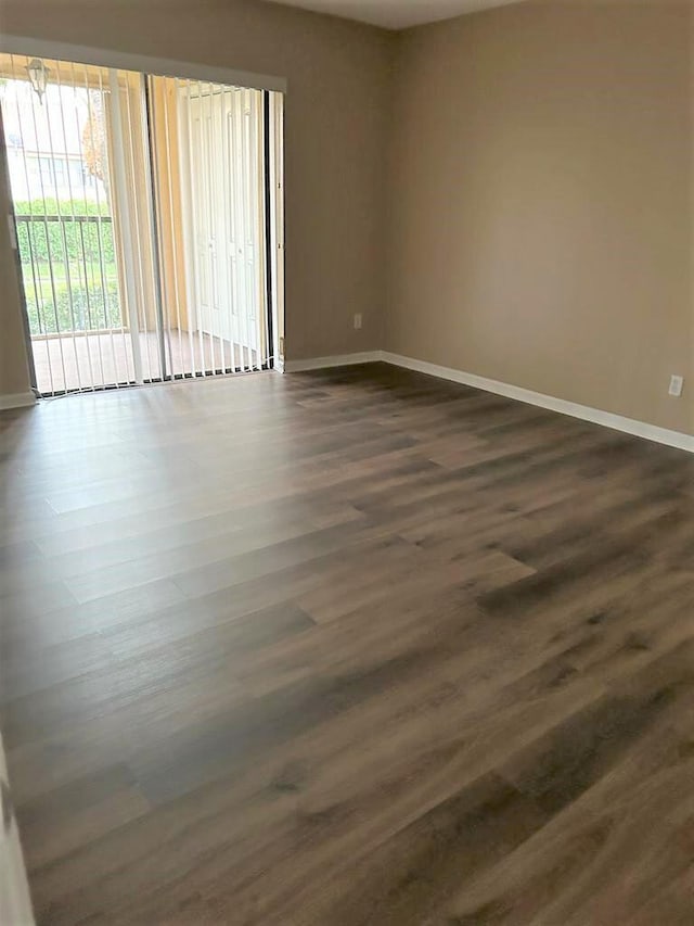 unfurnished room featuring dark hardwood / wood-style floors