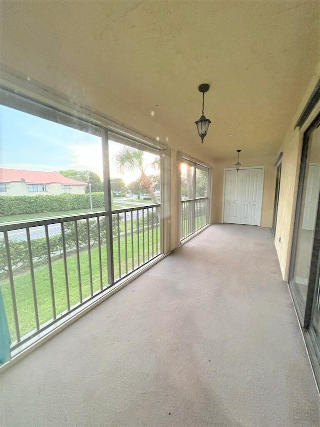 unfurnished sunroom with a wealth of natural light